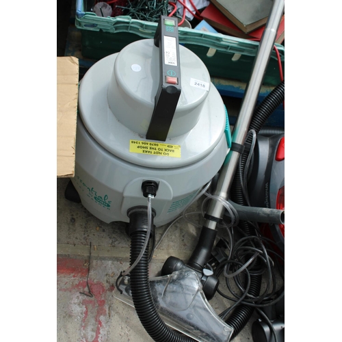 2418 - A VAX CARPET WASHER, A VAX VACUUM CLEANER AND A HOOVER VACUUM CLEANER