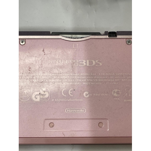100 - A PINK NINTENDO 3DS WITH CHARGER, CASE AND FIVE GAMES