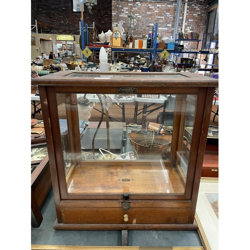75 - A W & J GEORGE LTD WOOD AND GLASS DISPLAY CABINET WITH LOWER DRAWER AND SLIDING FRONT
