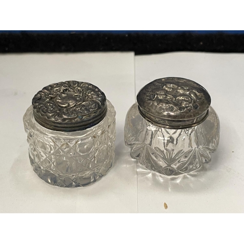95 - TWO MINIATURE CUT GLASS JARS WITH HALLMARKED SILVER TOPS ONE LONDON AND THE OTHER BIRMINGHAM