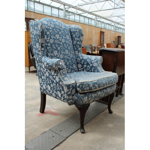 2864 - A GEORGE iii STYLE WINGED EASY CHAIR ON CABRIOLE LEGS