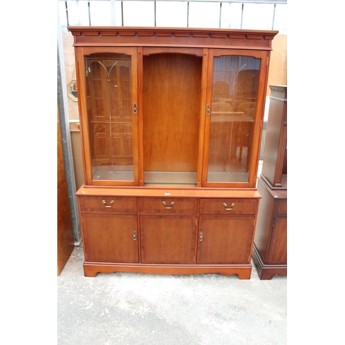 2868 - A MODERN YEW WOOD BOOKCASE ON BASE