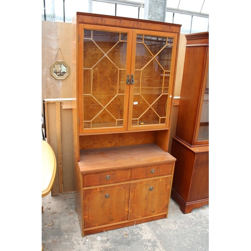 2869 - A YEW WOOD ASTRAGAL GLAZED TWO DOOR BOOKCASE ON BASE, 36