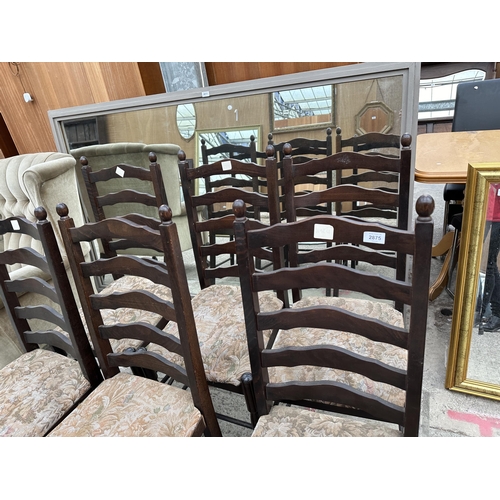 2875 - A SET OF SIX OAK LADDER BACK DINING CHAIRS