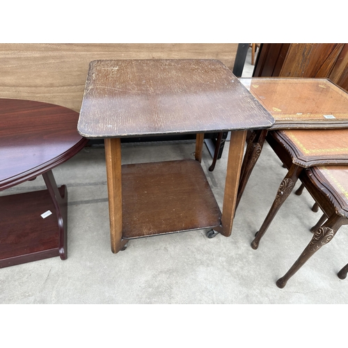 2880 - A LEATHER TOPPED MAHOGANY NEST OF TABLES, OAK TWO TIERED OCCASIONAL TABLE ON CASTERS AND A MAHOGANY ... 