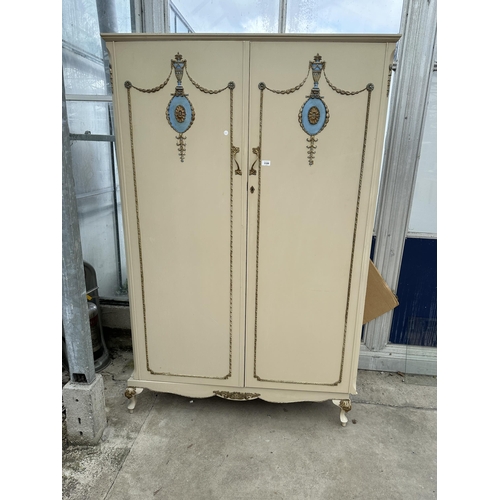2881 - A FRENCH STYLE CREAM AND GILT  TWO DOOR WARDROBE ON CABRIOLE SUPPORTS MADE BY WALNUT CABINET WORKS (... 