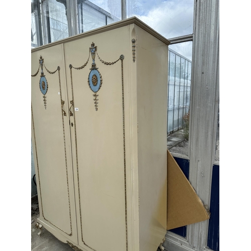 2881 - A FRENCH STYLE CREAM AND GILT  TWO DOOR WARDROBE ON CABRIOLE SUPPORTS MADE BY WALNUT CABINET WORKS (... 