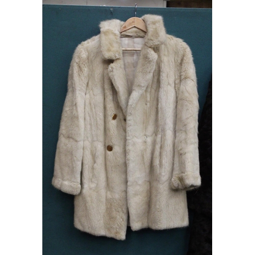 86 - A CREAM COLORED FUR JACKET