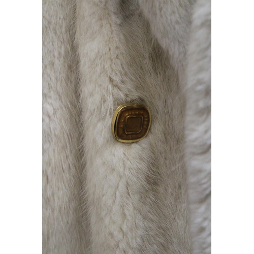 86 - A CREAM COLORED FUR JACKET