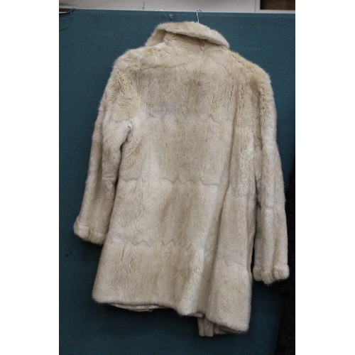 86 - A CREAM COLORED FUR JACKET