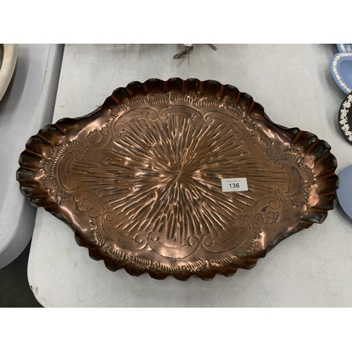 136 - AN ART NOVEAU REPOUSSE COPPER SERVING TRAY