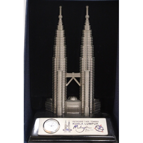 218 - A BOXED, SOLID PEWTER, PETRONASTOWERS CLOCK, HEIGHT 21CM