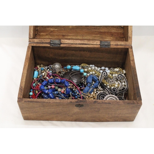 250 - A LARGE WOODEN CHEST FILLED WITH COSTUME JEWELLERY