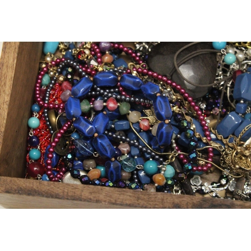 250 - A LARGE WOODEN CHEST FILLED WITH COSTUME JEWELLERY