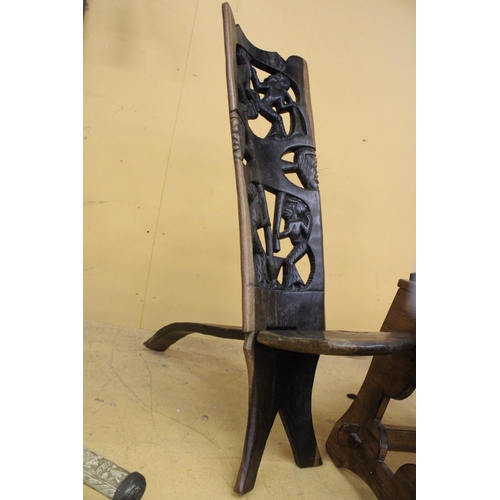 266 - A HAND CARVED AFRICAN CHAIR