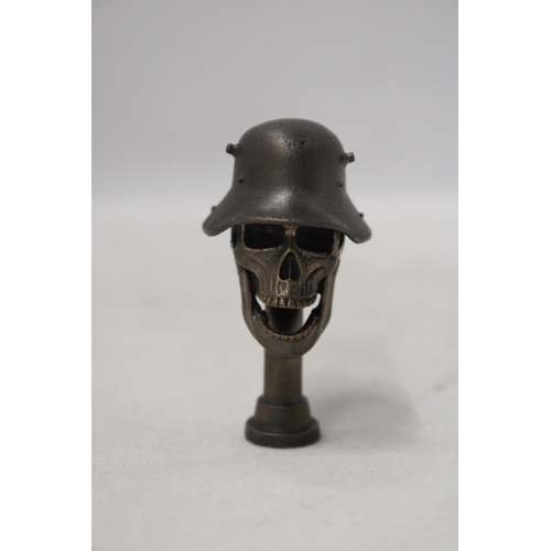 300 - A BRONZE SKULL WITH HELMET