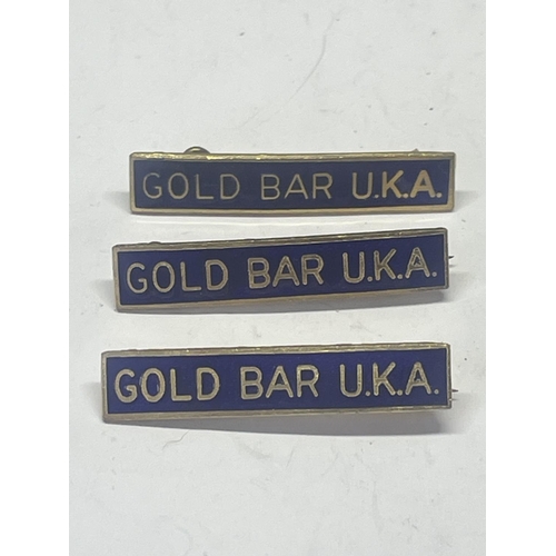 540 - THREE BLUE ENAMEL GOLD BAR U.K.A BADGES FORM THE 1970'S