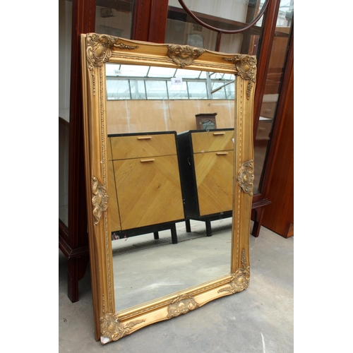 2835 - A GILT FRAMED WALL MIRROR, 35