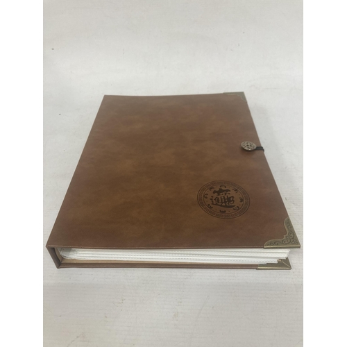 306 - A FOLDER CONTAINING IN EXCESS OF 160 VINTAGE WORLD BANK NOTES TO INCLUDE BANK OF INDONESIA RUPIAH, U... 