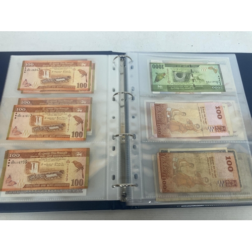 308 - A FOLDER CONTAINING IN EXCESS OF 100 VINTAGE WORLD BANK NOTES TO INCLUDE THE CENTRAL BANK OF EGYPT 5... 