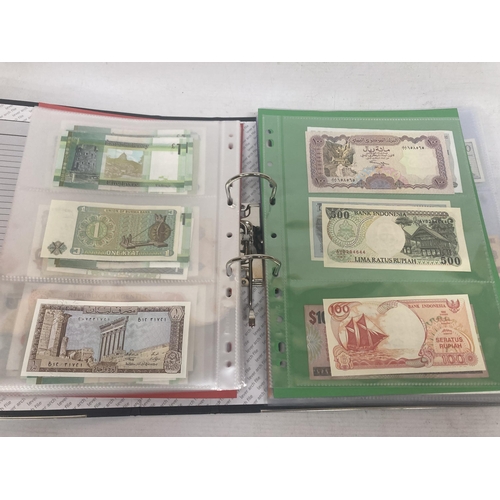 323 - AN ALBUM CONTAINING 69 DOUBLE SIDED WALLETS OF VINTAGE WORLD BANK NOTES TO INCLUDE CAMBODIAN BANK NO... 