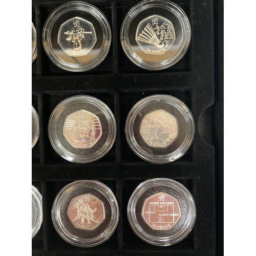 340 - A MAHOGANY COIN BOX CONTAINING TWELVE ROYAL MINT 2012 OLYMPIC SILVER 50P COINS TO INCLUDE AQUATICS, ... 