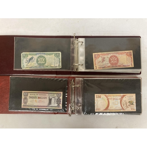 345 - TWO FOLDERS CONTAINING A LARGE QUANTITY OF VINTAGE WORLD BANK NOTES TO INCLUDE GHANA, UNITED ARAB EM... 