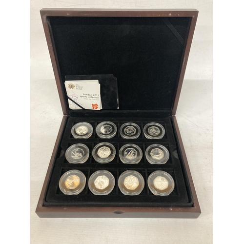 350 - A MAHOGANY COIN BOX CONTAINING TWELVE ROYAL MINT 2012 OLYMPIC SILVER 50P COINS TO INCLUDE TENNIS, TA... 