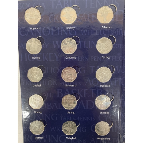 355 - A COMPLETE 2011 50P SPORTS ALBUM CONTAINING 29 COINS TO INCLUDE AQUATICS, BADMINTON, TABLE TENNIS, W... 