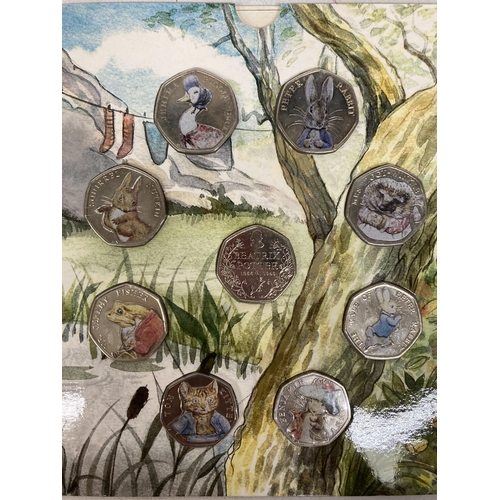 392 - A COLLECTION OF COLLECTOR'S FIFTY PENCE COIN PACKAGES TO INCLUDE ROYAL MINT BEATRIX POTTER PETER RAB... 