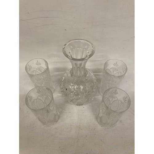 22 - A WATERFORD CRYSTAL SEAHORSE CARAFE WITH FOUR TUMBLERS