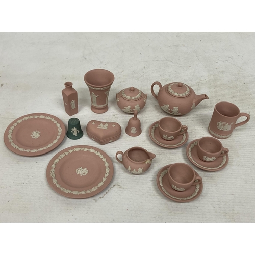 39 - A QUANTITY OF MINIATURE PINK WEDGWOOD JASPERWARE TO INCLUDE A MINI TEASET, HEART TRINKET, MUG, ETC.,