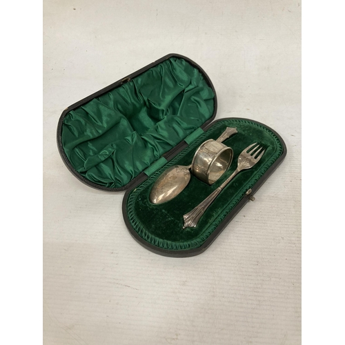 4 - A HALLMARKED SHEFFIELD CHRISTENING SET TO INCLUDE FORK, SPOON AND NAPKIN RING COMPLETE WITH ORIGINAL... 