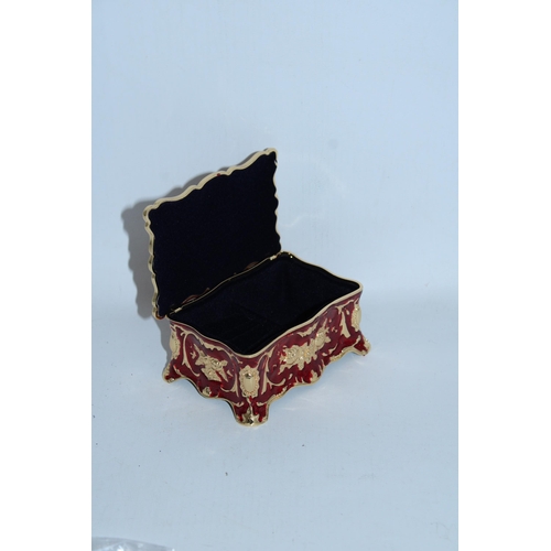 107 - A RED AND GOLD ENAMEL JEWELLERY BOX