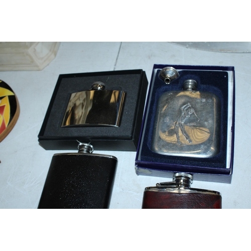 135 - A COLLECTION OF HIP FLASKS