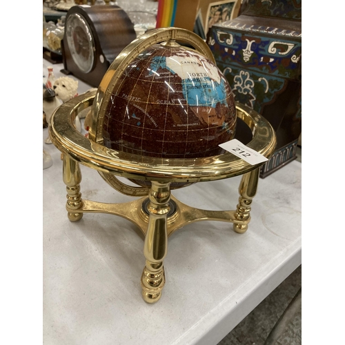 212 - A GEMSTONE GLOBE WITH A COMPASS TO THE BASE