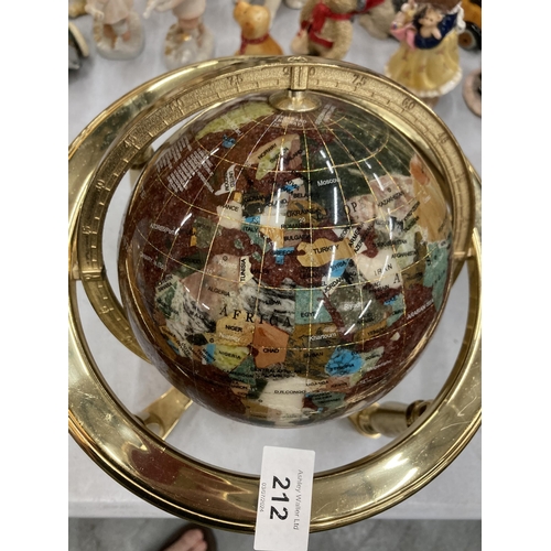 212 - A GEMSTONE GLOBE WITH A COMPASS TO THE BASE