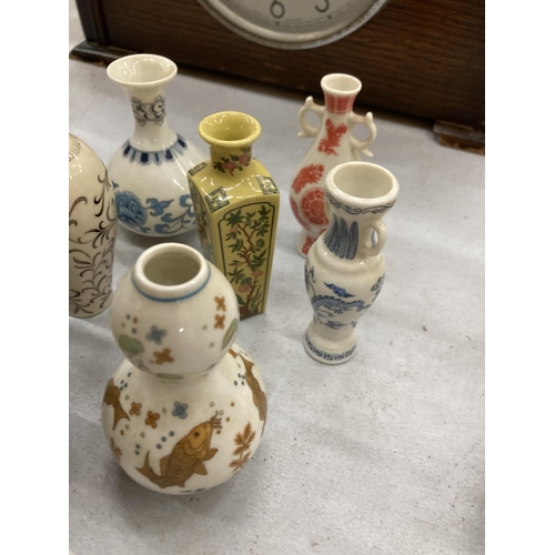 216 - TWELVE MINIATURE ORIENTAL VASES