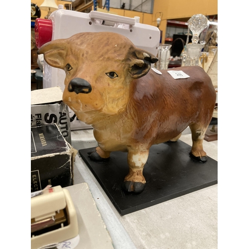 248 - A LARGE BUTCHERS SHOP WINDOW, BULL ON A STAND, HEIGHT 22CM, LENGTH 35CM