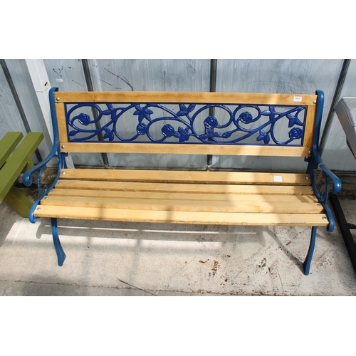 1692 - A WOODEN SLATTED GARDEN BENCH WITH CAST BENCH ENDS AND FLORAL CAST BACK