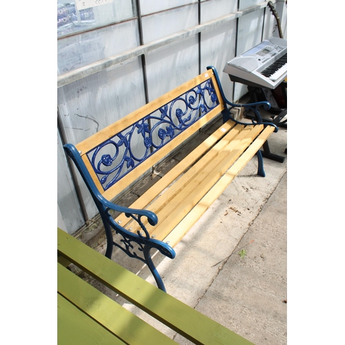 1692 - A WOODEN SLATTED GARDEN BENCH WITH CAST BENCH ENDS AND FLORAL CAST BACK