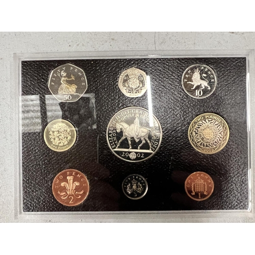 460 - TWO UK CASED SETS OF THE 2002 COIN YEAR PACK