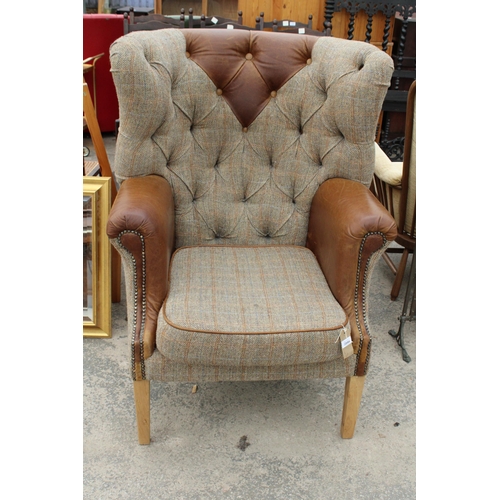 2844 - A 'HUNTING LODGE' HARRIS TWEED AND LEATHER BUTTON-BACK WINGED EASY CHAIR WITH BRASS STUDDING ON TAPE... 