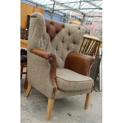 2844 - A 'HUNTING LODGE' HARRIS TWEED AND LEATHER BUTTON-BACK WINGED EASY CHAIR WITH BRASS STUDDING ON TAPE... 