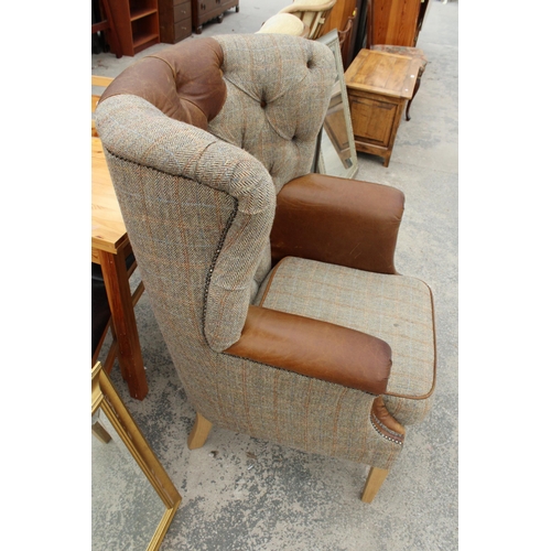 2844 - A 'HUNTING LODGE' HARRIS TWEED AND LEATHER BUTTON-BACK WINGED EASY CHAIR WITH BRASS STUDDING ON TAPE... 