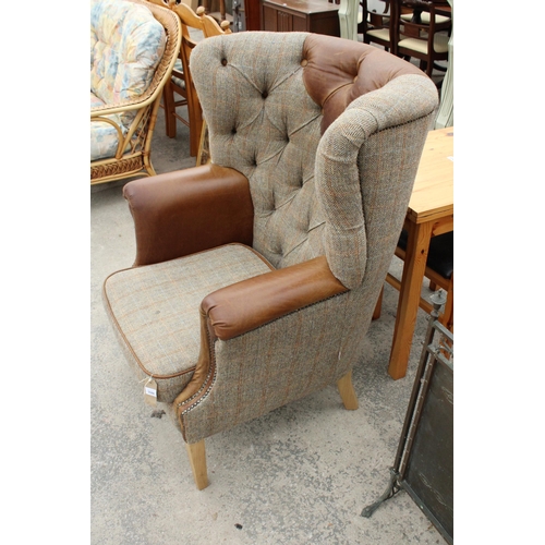 2844 - A 'HUNTING LODGE' HARRIS TWEED AND LEATHER BUTTON-BACK WINGED EASY CHAIR WITH BRASS STUDDING ON TAPE... 