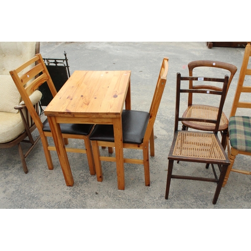 2807 - A SMALL PINE DRAW-LEAF TABLE AND TWO CHAIRS AND TWO BEDROOM CHAIRS