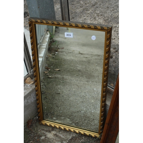 2816 - A GILT FRAMED WALL MIRROR 25