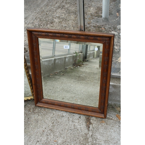 2817 - AN EDWARDIAN CARVED OAK FRAMED WALL MIRROR WITH BEVEL EDGE, 25