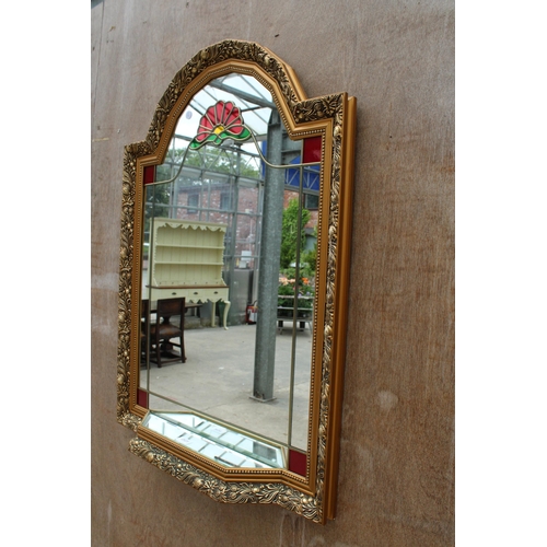 2825 - A GILT EFFECT WALL MIRROR WITH COLOURED GLASS AND MIRRORED SHELF, 35